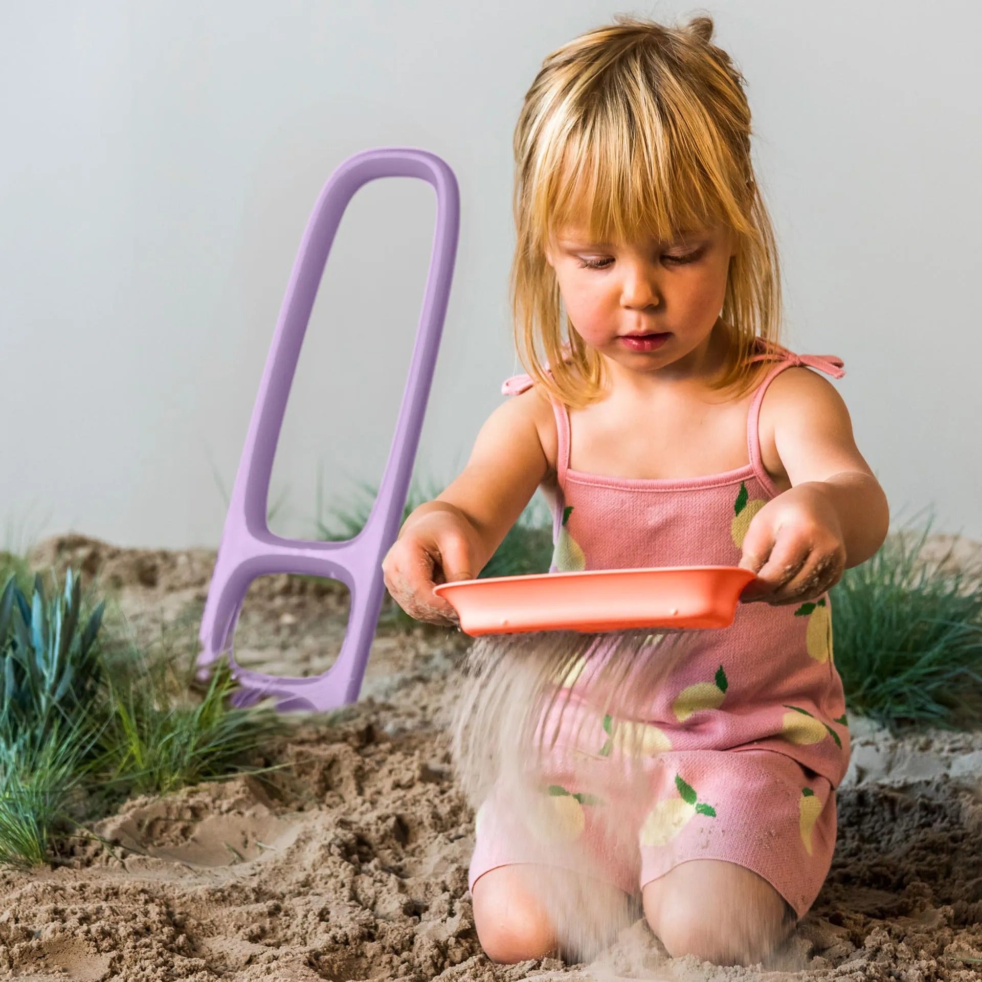 Kids playing with beach shovel at the beach Australia