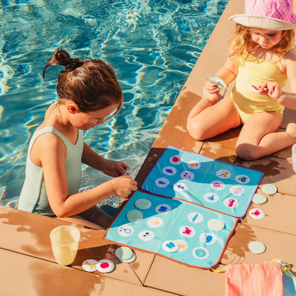 Kids playing Bingo matching game by Quut